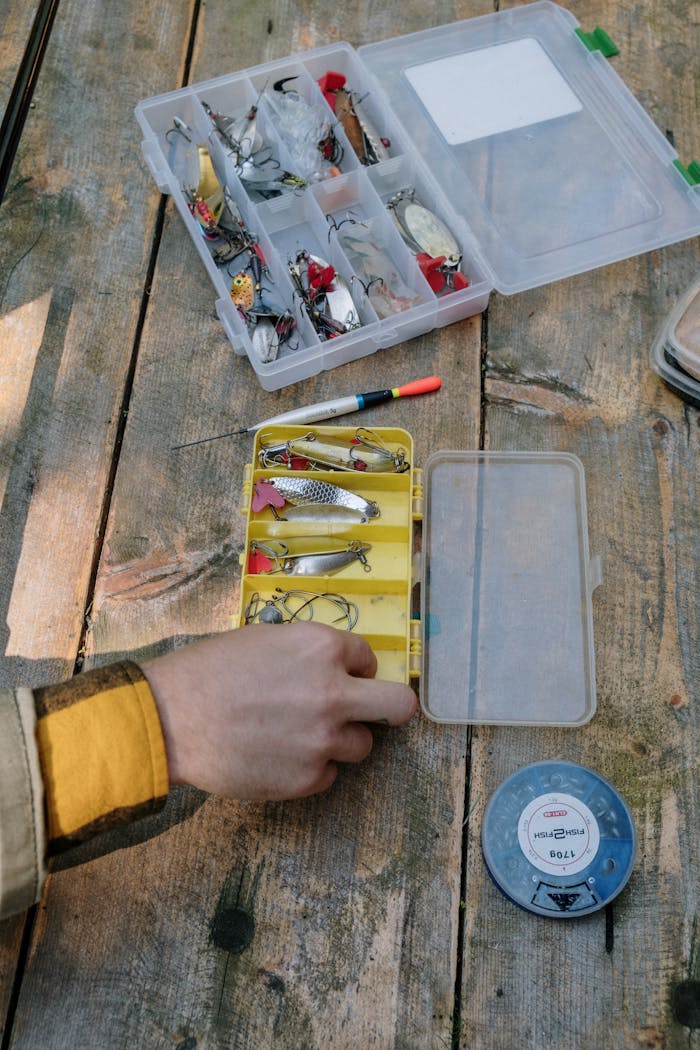 Person Holding Yellow and White Plastic Tool